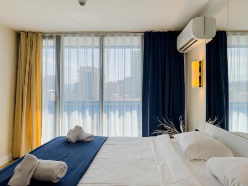 Ένα ή περισσότερα κρεβάτια σε δωμάτιο στο Beautiful Sea View first Line