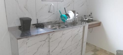 Køkken eller tekøkken på Flats dos Fernandes Geribá