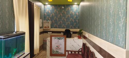 a room with a table and chairs in a room at ABS Palace Ayodhya in Faizābād