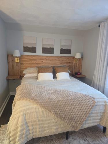 a bedroom with a large bed with two pillows at Cozy Room in Revere near Beachmont Blue Line Station in Revere