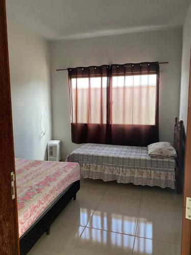 Postel nebo postele na pokoji v ubytování Casa Bela Vista