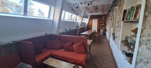 a living room with a couch and a table at Refuge d'hiver de N&M in Tende