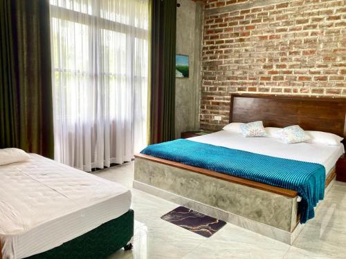 Postel nebo postele na pokoji v ubytování Ehala Arana