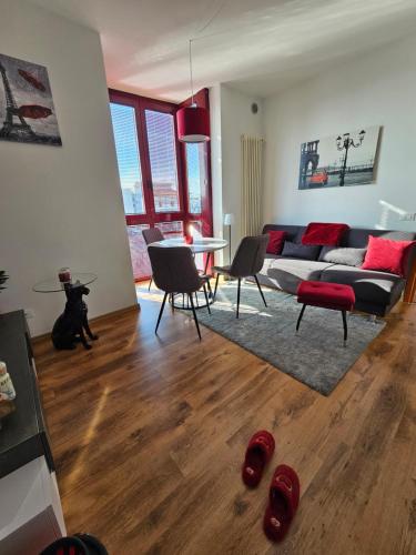 a living room with a couch and a table at Rubin Stay-Karabas Apartments in Vicenza
