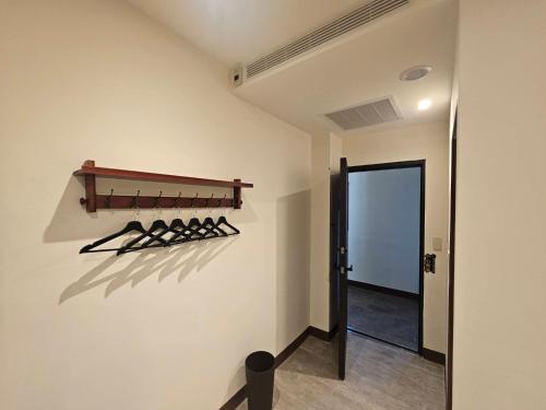 a room with a wall with a rack of weapons at meetstar in Hsia-pu-hsia