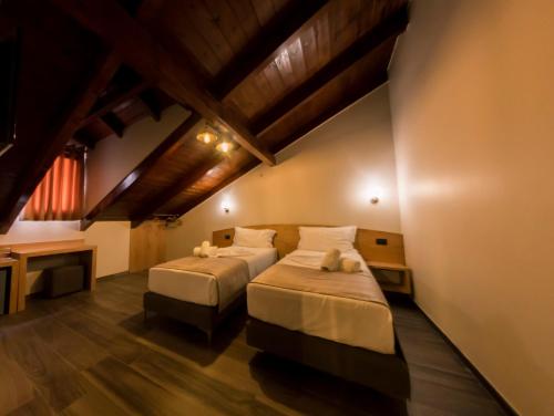 Postel nebo postele na pokoji v ubytování Hotel Pandora Residence