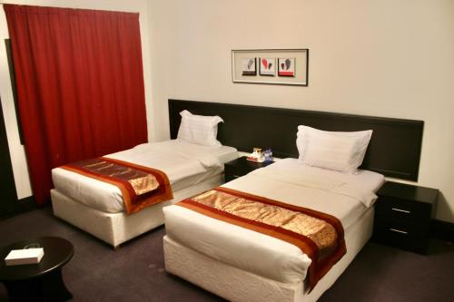 Postel nebo postele na pokoji v ubytování Summer Land Hotel