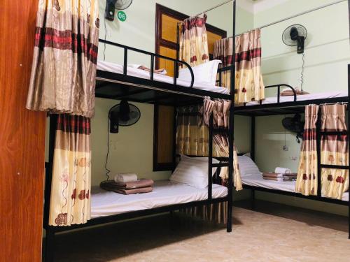 Postel nebo postele na pokoji v ubytování Sun Mountain Hostel