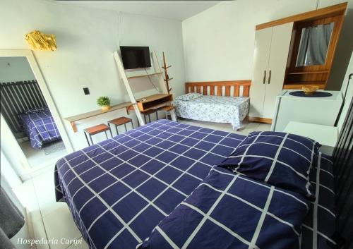 Cama o camas de una habitación en Hospedaria Caripí