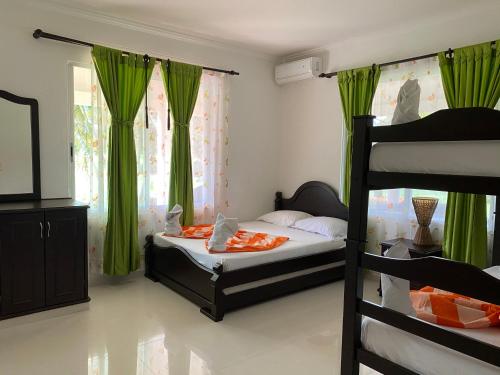 Una cama o camas en una habitación de Yopo Resort