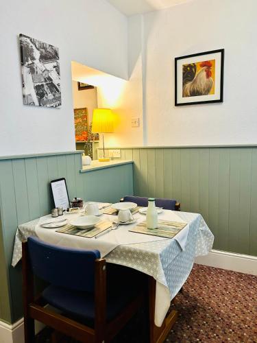 a table in a room with a table and chairs at Arden House in Arundel