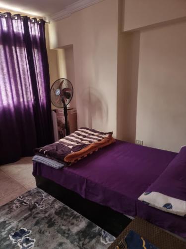 Ένα ή περισσότερα κρεβάτια σε δωμάτιο στο Taher's family -price appears for a bed in double bedroom