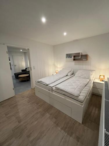 Ένα ή περισσότερα κρεβάτια σε δωμάτιο στο Ferienwohnung Eider