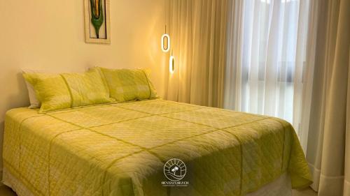 En eller flere senge i et værelse på Studio 150m do mar | Ar | Piscina | Aceita Pet