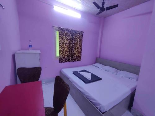 Ένα ή περισσότερα κρεβάτια σε δωμάτιο στο Hotel O Shakuntala Park Bus Terminus Behala