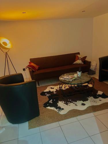 Posezení v ubytování Le Cocoon caché avec parking