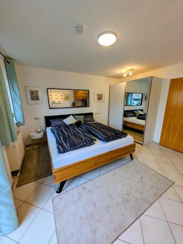 a bedroom with a large bed in a room at Appartement Mettenberg in Biberach an der Riß