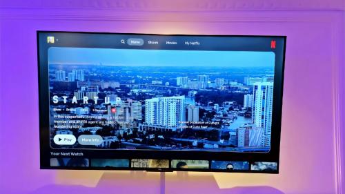 a computer screen with a view of a city at Chic Layover Hub 15 min from JKIA Airport in Nairobi