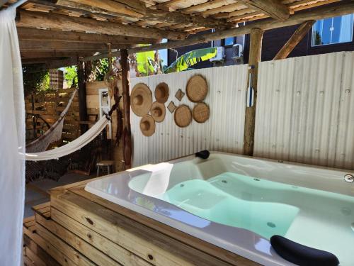 a jacuzzi tub in the middle of a room at Casa de praia com piscina e jacuzzi totalmente privativa in Imbituba