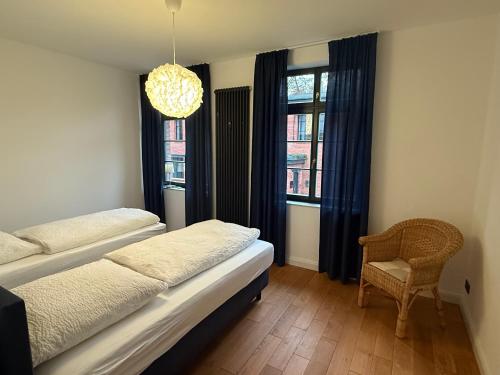 Postel nebo postele na pokoji v ubytování Alte Kammfabrik OG