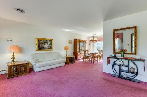 a living room with a couch and a table at 2 Mi to APG Edgewood Family Home with Fenced Yard in Edgewood