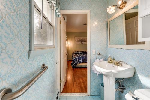 a bathroom with a sink and a mirror at 2 Mi to APG Edgewood Family Home with Fenced Yard in Edgewood