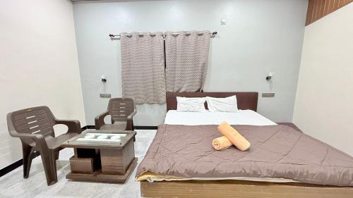 Postel nebo postele na pokoji v ubytování Swara Homestay