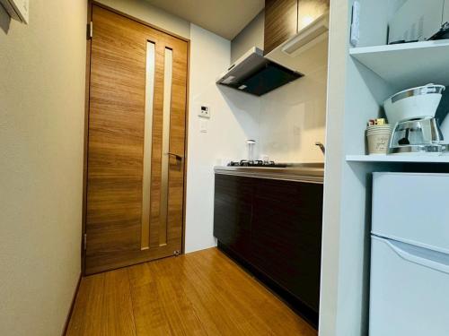 Kuchyň nebo kuchyňský kout v ubytování LuxurySweet 博多駅南63