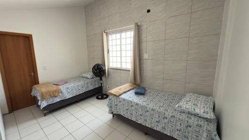 Un ou plusieurs lits dans un hébergement de l'établissement Apartamento Vista Mar São Luís Litorânea