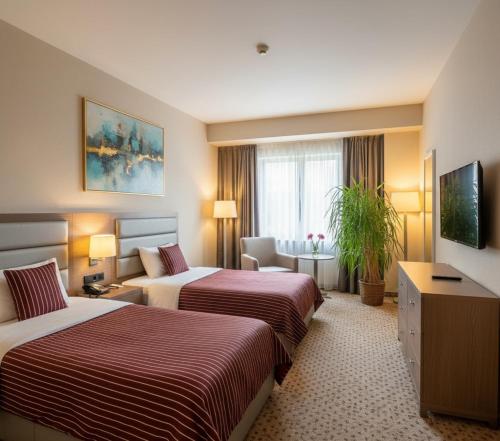 Postel nebo postele na pokoji v ubytování Mahmut Apart