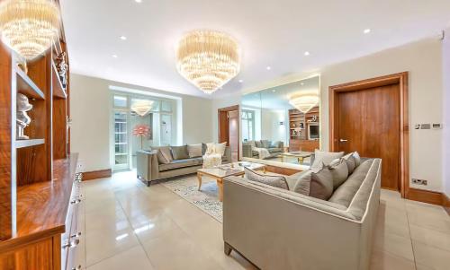 a large living room with couches and a table at 250 SqM MEGA MANSION in London