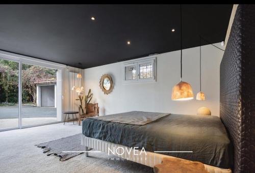 Postel nebo postele na pokoji v ubytování L'Écrin des Greens