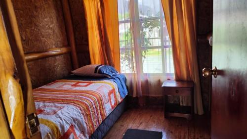 Ένα ή περισσότερα κρεβάτια σε δωμάτιο στο Cabaña cipres