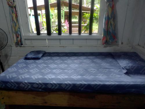 Ένα ή περισσότερα κρεβάτια σε δωμάτιο στο Hostal ladrillerossurf