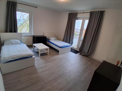 Postel nebo postele na pokoji v ubytování Crew Quartier ALL-INCLUSIVE Serviced Apartments ideal für Monteure 3 Schlafzimmer