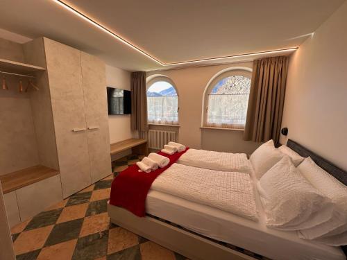 Postel nebo postele na pokoji v ubytování Al Piz - Dimora Alpina