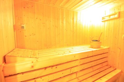 a wooden sauna with a tub and a fan at New Luxury - Entire Villa - AC - Climatisation - Sauna - Free Private Parking - Fully Equipped - From 1 to 6 guests in LʼHay-les-Roses
