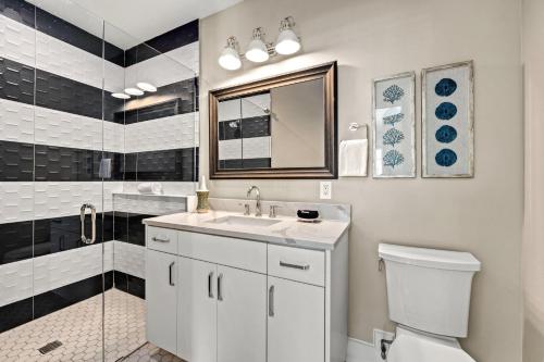 a bathroom with a sink and a shower and a toilet at Beach Fanta Sea - 149 in Bailey Hall