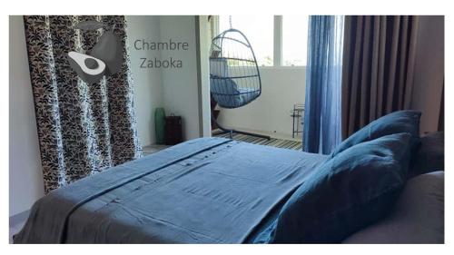 Ένα ή περισσότερα κρεβάτια σε δωμάτιο στο VillAnolis Martinique