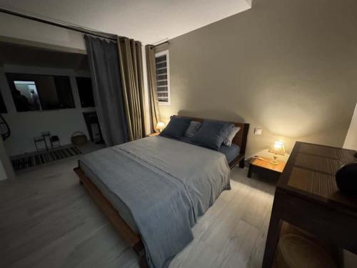 Ένα ή περισσότερα κρεβάτια σε δωμάτιο στο VillAnolis Martinique