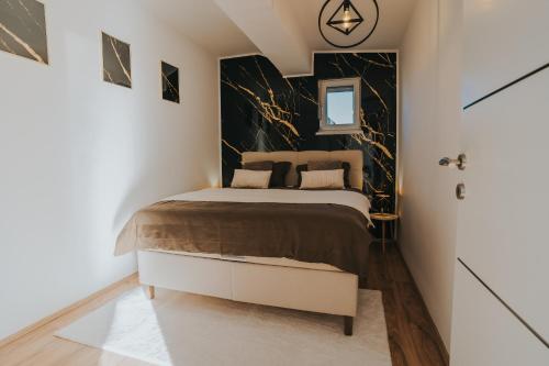 Postel nebo postele na pokoji v ubytování TheLuxPenthouseBugojno