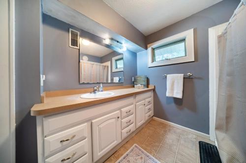 a bathroom with a sink and a mirror at Cuyahoga Falls 3 bedroom 2 bath in Cuyahoga Falls