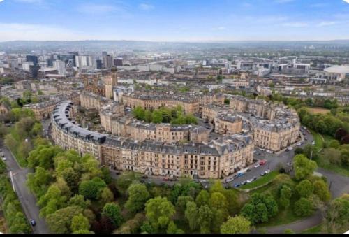 an aerial view of a city with buildings at Grand in the Park in Glasgow