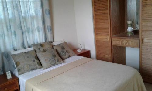 Postel nebo postele na pokoji v ubytování Serenity Condos