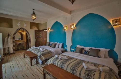 Ένα ή περισσότερα κρεβάτια σε δωμάτιο στο Your Hotel Room Merzouga
