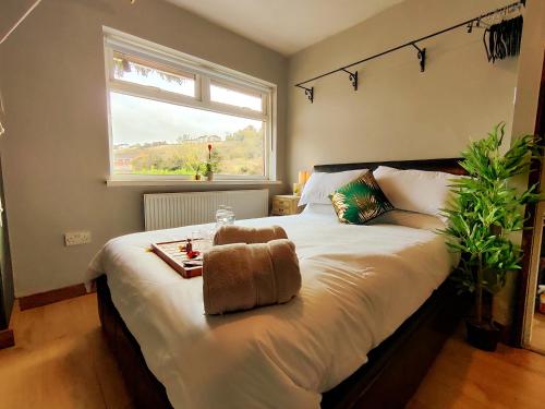 a bedroom with a bed with a teddy bear on it at Durham Hot Tub - Steam Spa - Eco Retreat - Pizza Oven - Log Burner - Pets Ok - Garden in Langley Park