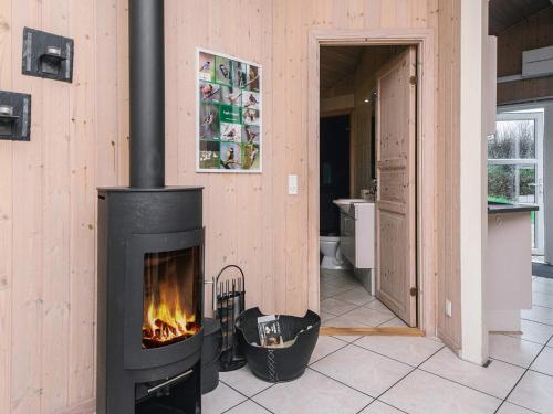 a fireplace in a room with a bathroom at 6 person holiday home in Oksbøl-By Traum in Oksbøl