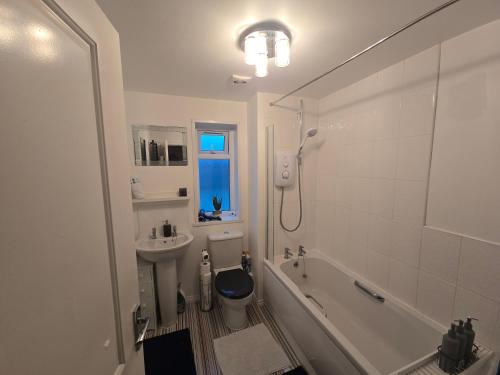 a bathroom with a toilet and a sink and a shower at Bridge View Stayz in Plymouth