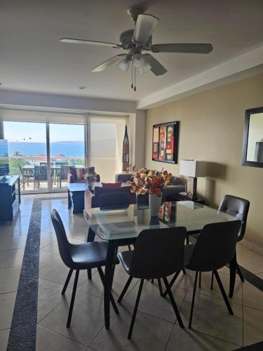 a living room with a table and chairs and a couch at 8th Floor Villa Magna Condo in Nuevo Vallarta