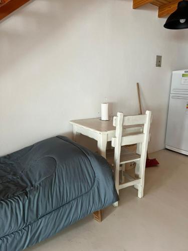 a table and a chair next to a table and a table and a table at Chalten Mountain Loft 6 in El Chalten